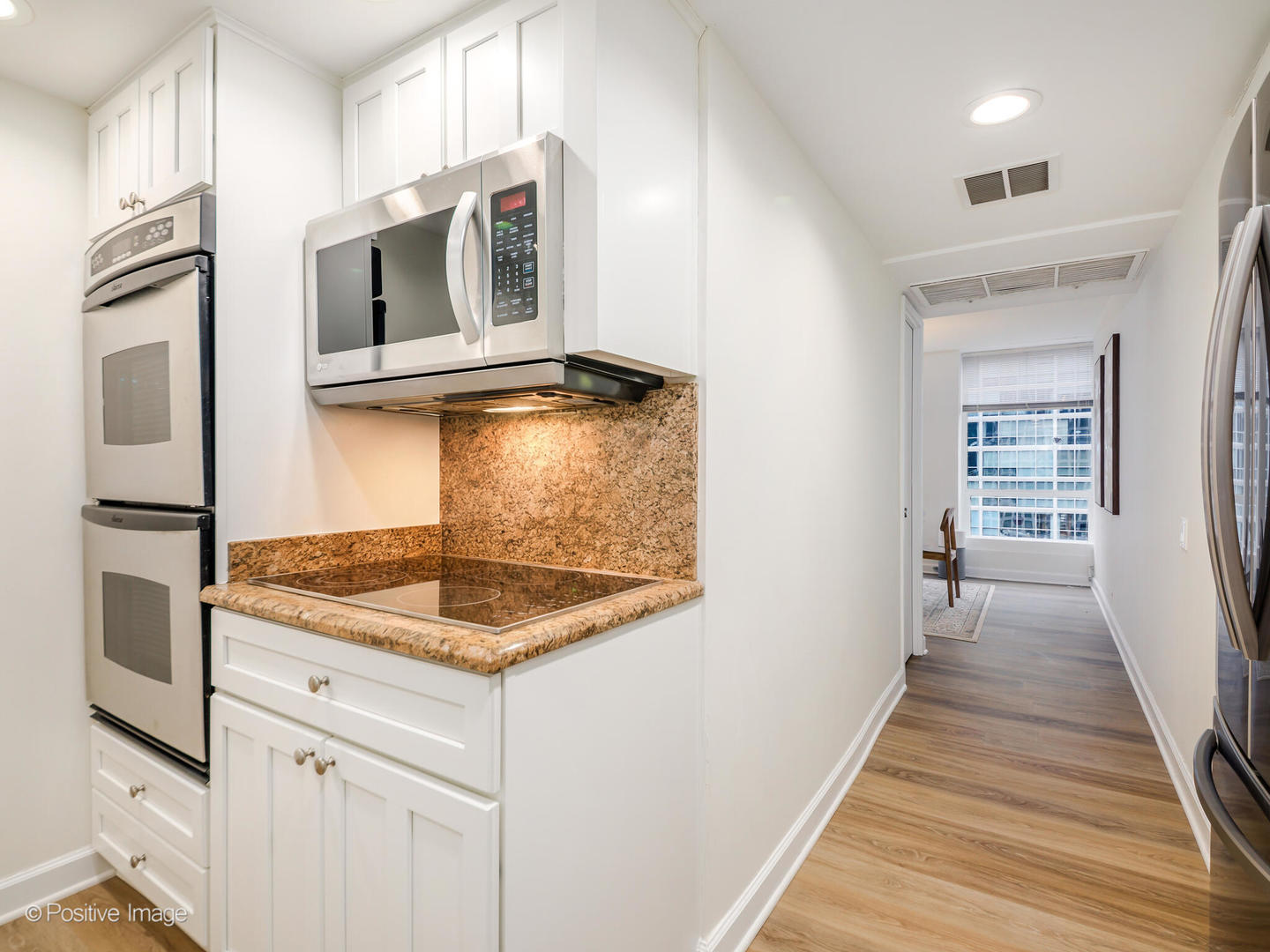260 East Chestnut Street, Unit 2507 Chicago, IL 60611 - Photo 9 of 22 a kitchen with stainless steel appliances granite countertop a sink and dishwasher
