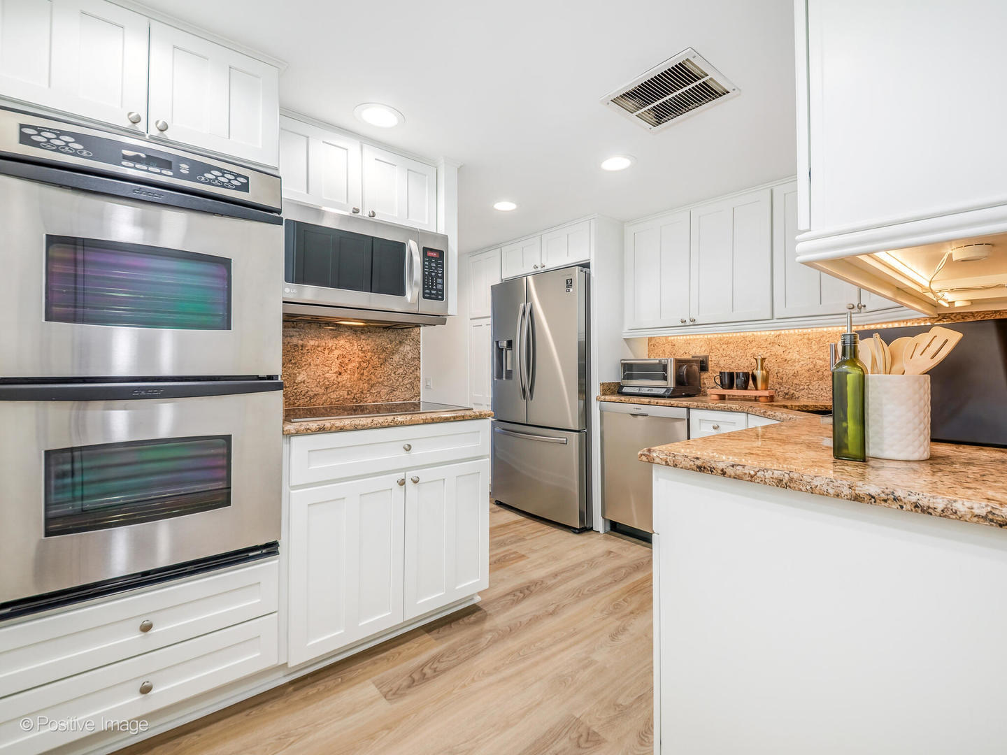 260 East Chestnut Street, Unit 2507 Chicago, IL 60611 - Photo 10 of 22 a kitchen with a refrigerator an oven and cabinets