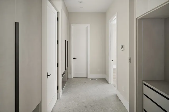 a view of a hallway with a door