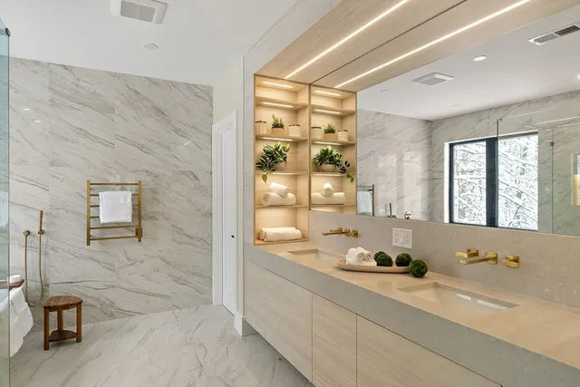 a spacious bathroom with a granite countertop sink a toilet and shower