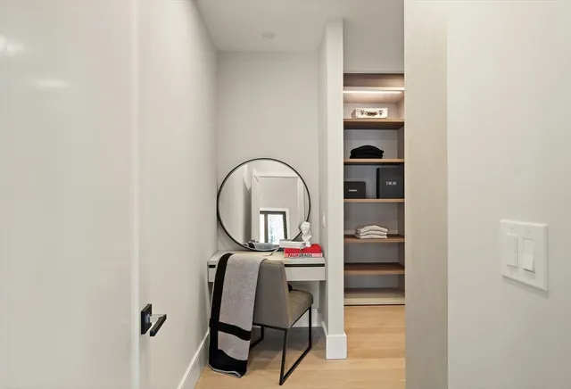 a living room with furniture and kitchen view