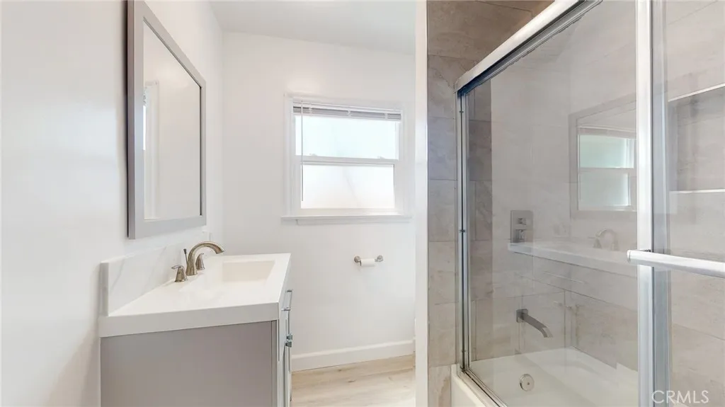239 3rd Avenue Venice, CA 90291 - Photo 12 of 24 a bathroom with a shower sink and mirror