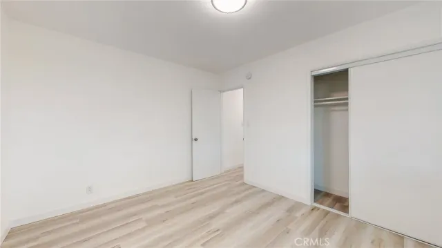 a picture of a wall with a rug and a painting