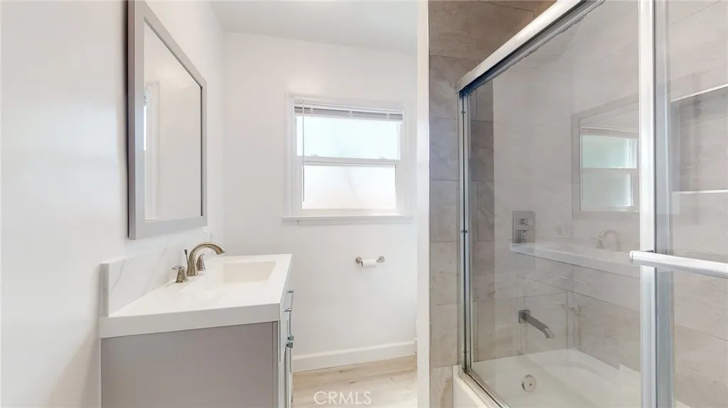 239 3rd Avenue Venice, CA 90291 - Photo 5 of 24 a bathroom with a shower sink and mirror