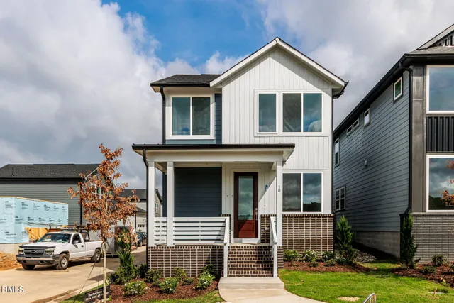 a front view of a house with garage