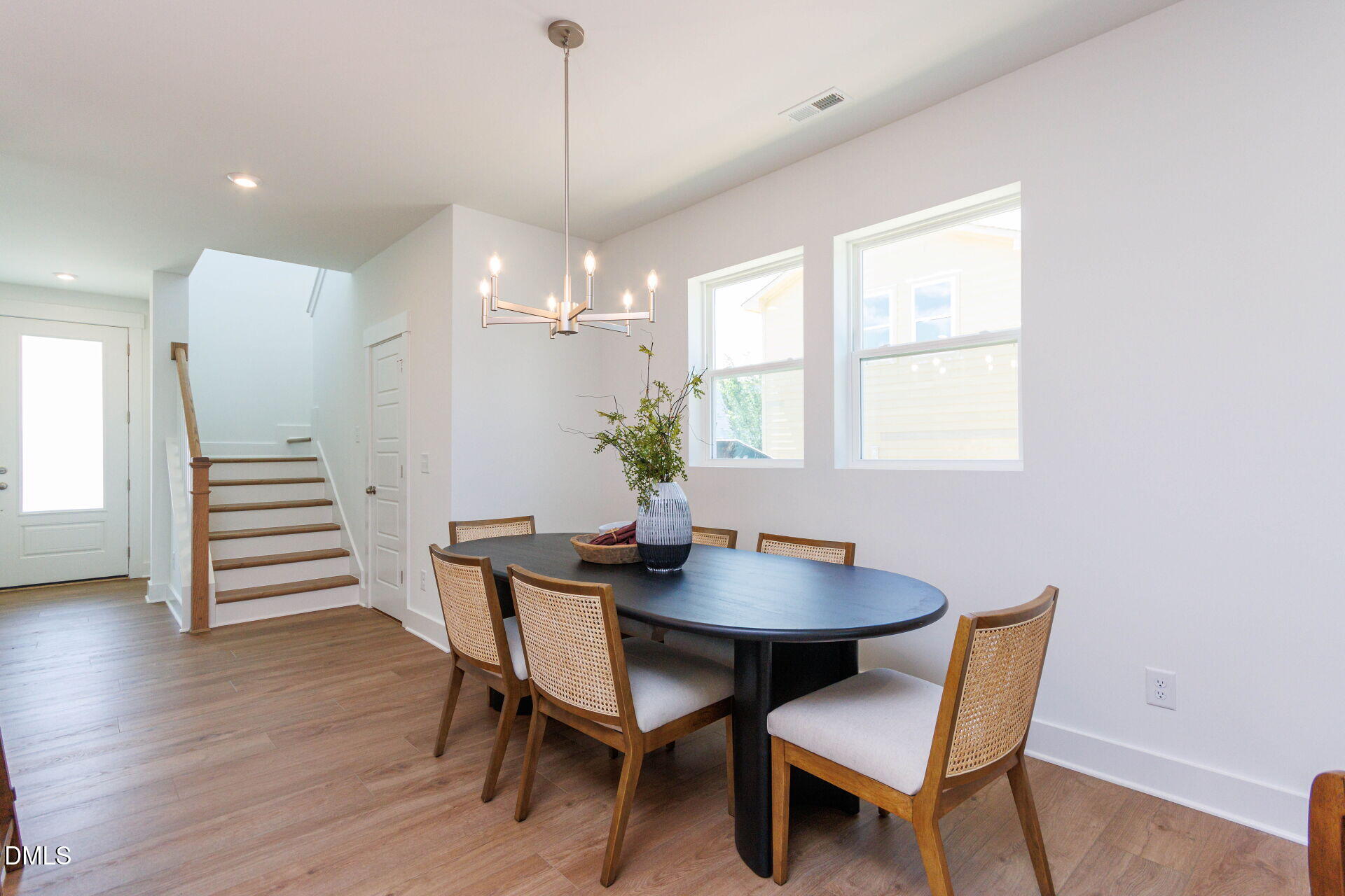 44 Relaxing Way Pittsboro, NC 27312 - Photo 12 of 19 a dining room with furniture a chandelier and wooden floor