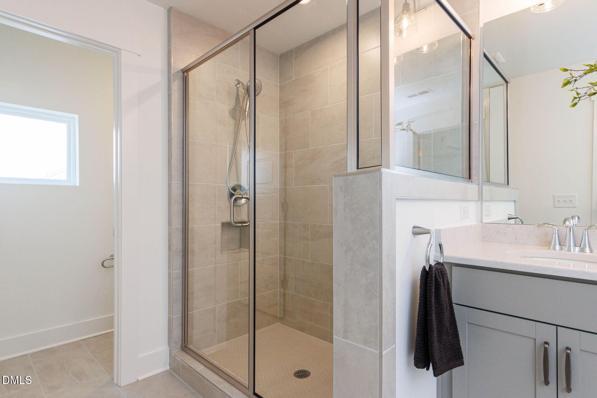 44 Relaxing Way Pittsboro, NC 27312 - Photo 15 of 19 a bathroom with a shower sink vanity and mirror