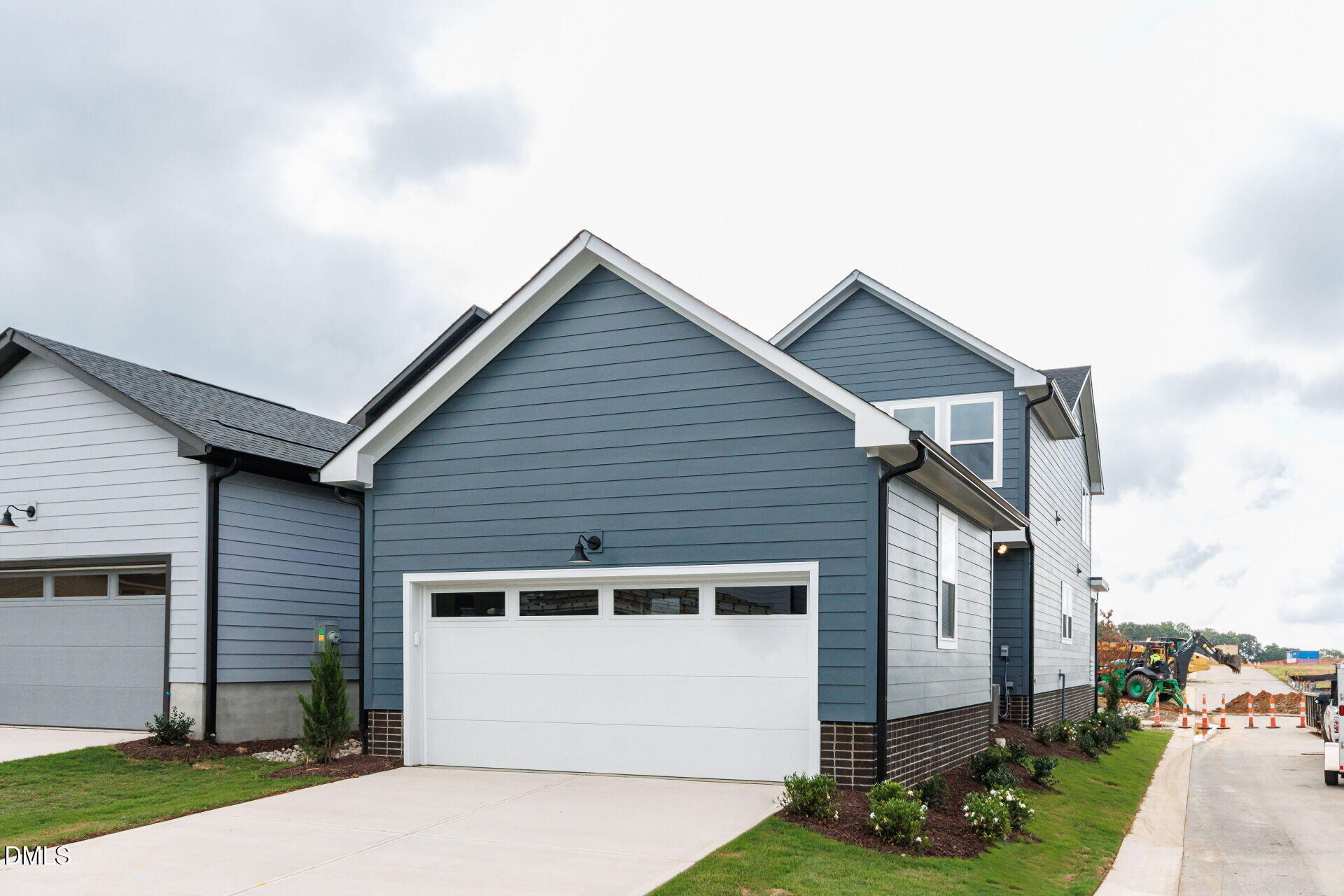 44 Relaxing Way Pittsboro, NC 27312 - Photo 19 of 19 a front view of a house with a garden and garage