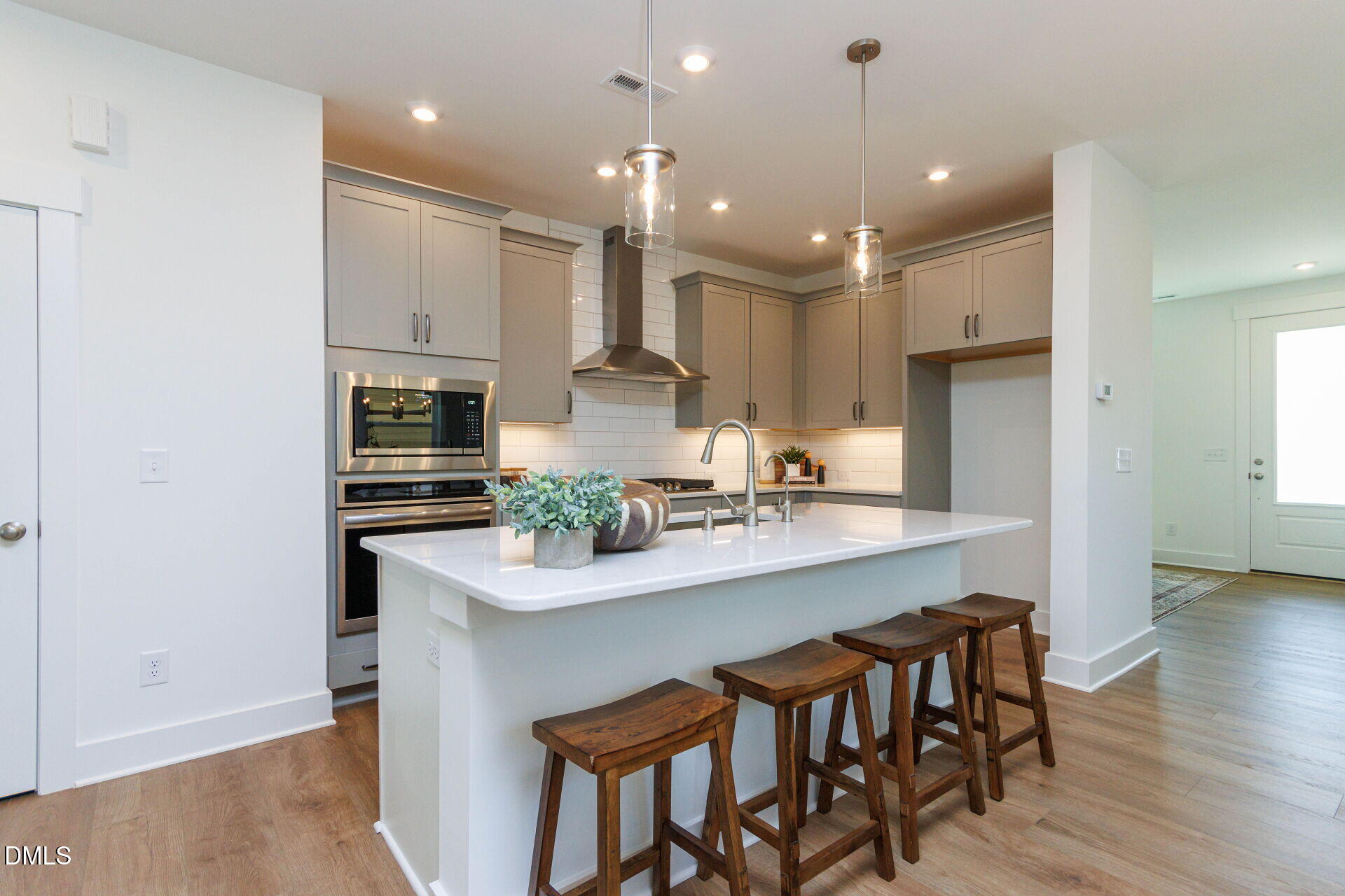 44 Relaxing Way Pittsboro, NC 27312 - Photo 6 of 19 a kitchen with kitchen island granite countertop a sink and refrigerator