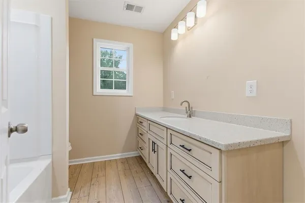 a kitchen with a sink and a window
