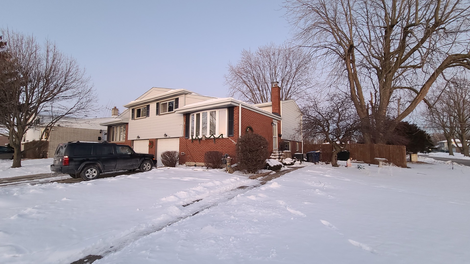 809 Beau Drive Des Plaines, IL 60016 - Photo 2 of 9 a car parked in front of a house