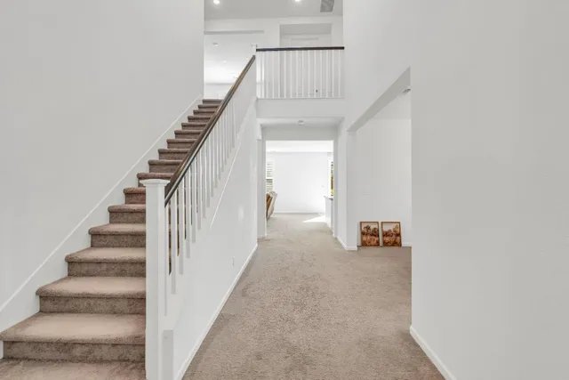 a living room with furniture flat screen and a window