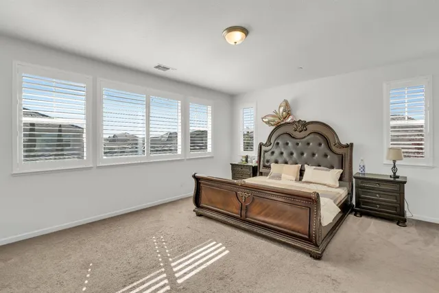 a view of walk in closet with clothes