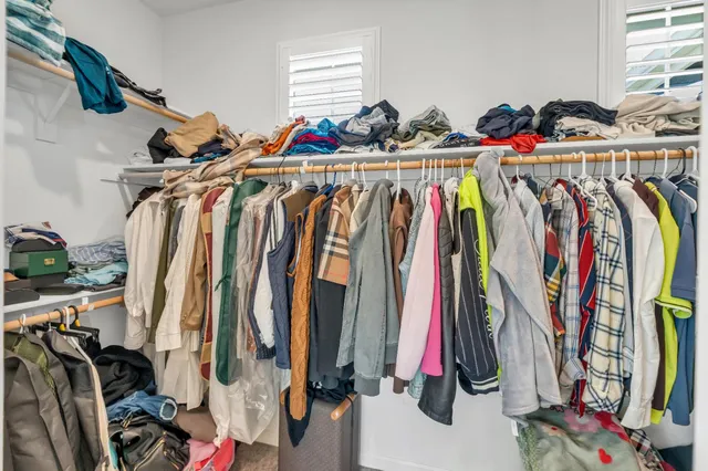 a white toilet sitting next to a shower curtain