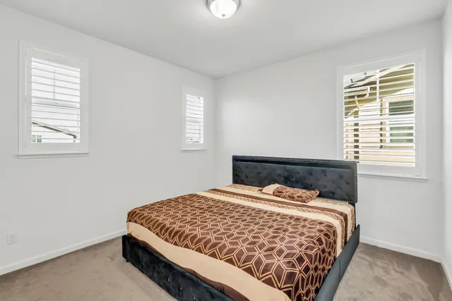 a view of an empty room with closet