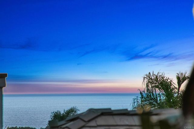 a view of a patio with table and chairs and potted plants