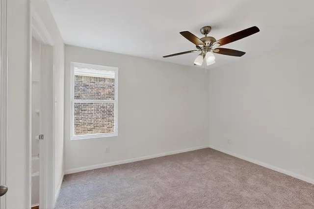 a bathroom with a sink a toilet a mirror and vanity