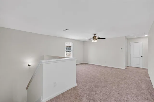 an empty room with fan