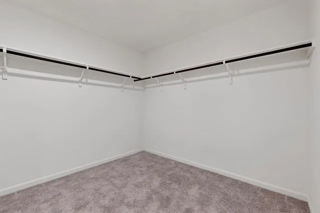 a workspace room with a ceiling fan and a ceiling fan