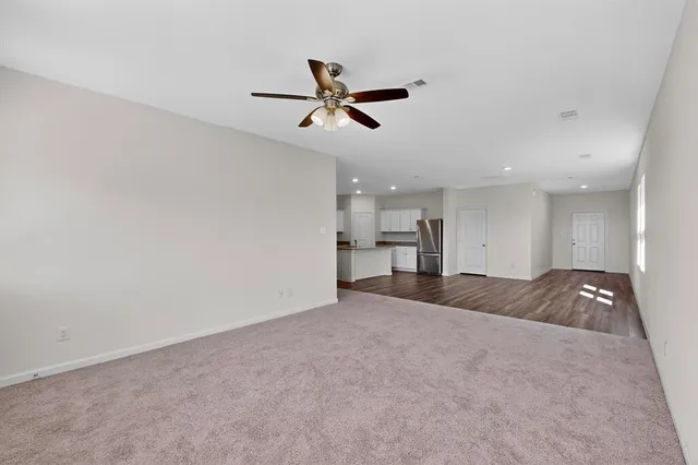 a view of a livingroom and a window