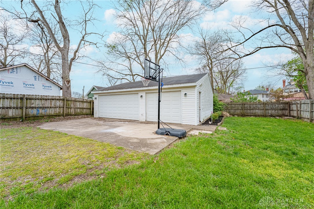 308 Yankee Road Middletown, OH 45044 - Photo 47 of 47 This spacious backyard features a detached garage and ample green space for outdoor activities.