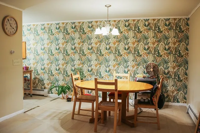 a dining room with furniture and wooden floor