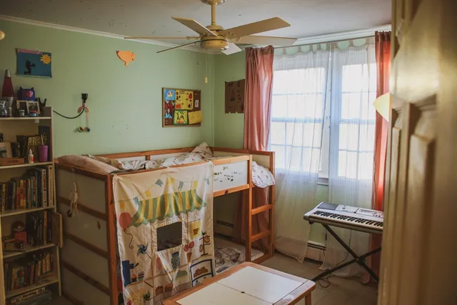 a bed room with a bed and a window