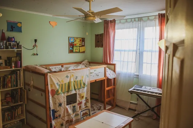 a bed room with a bed and a window