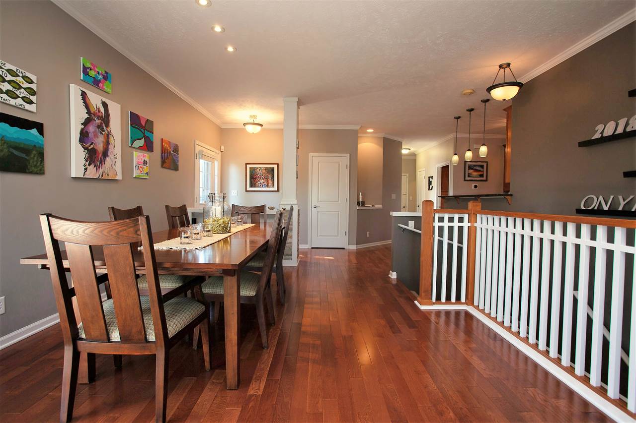 4403 Perry Ridge Lane Loves Park, IL 61111 - Photo 11 of 25 a dining room with furniture and wooden floor