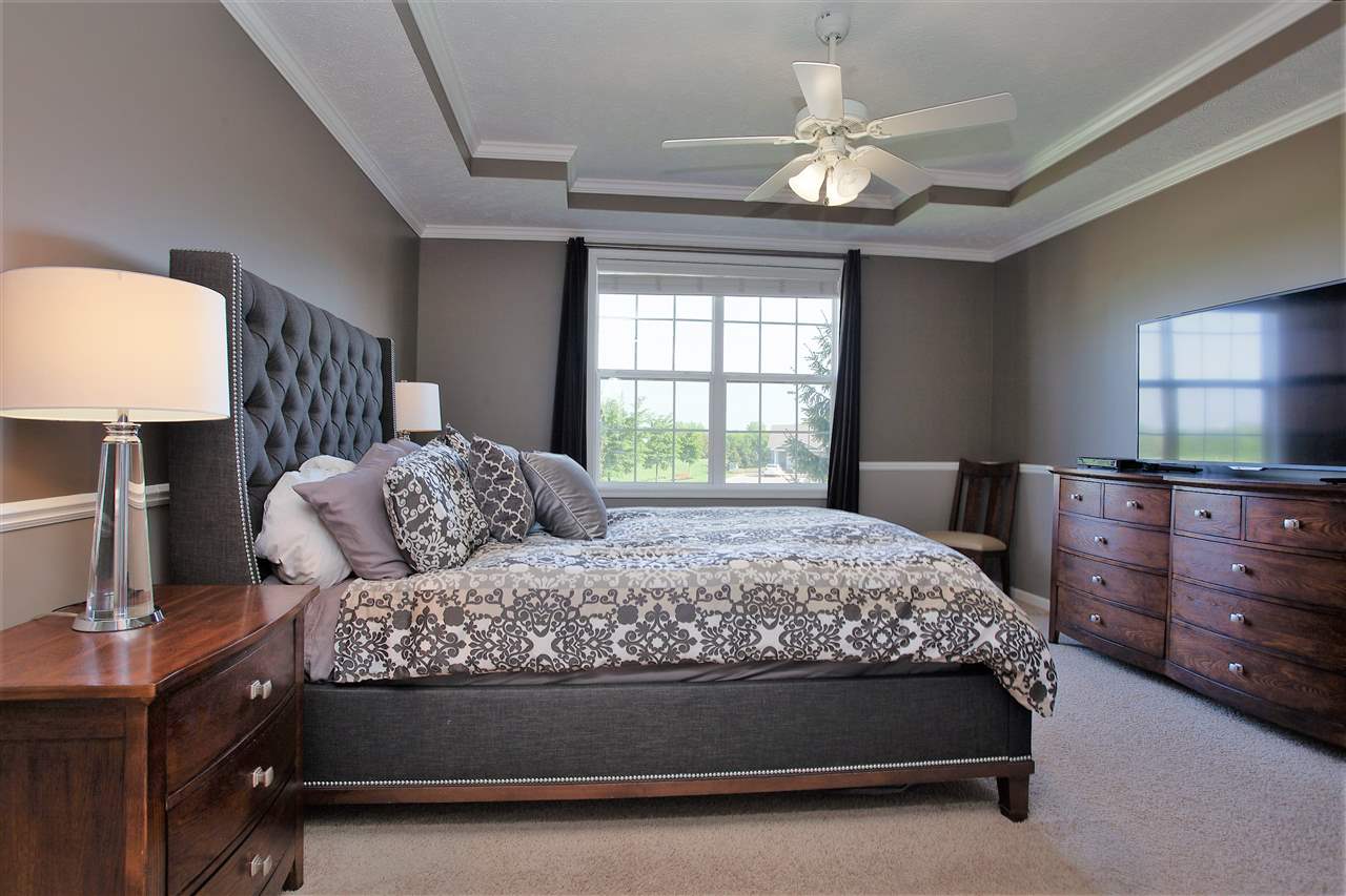 4403 Perry Ridge Lane Loves Park, IL 61111 - Photo 16 of 25 a bedroom with a bed and a lamp on dresser