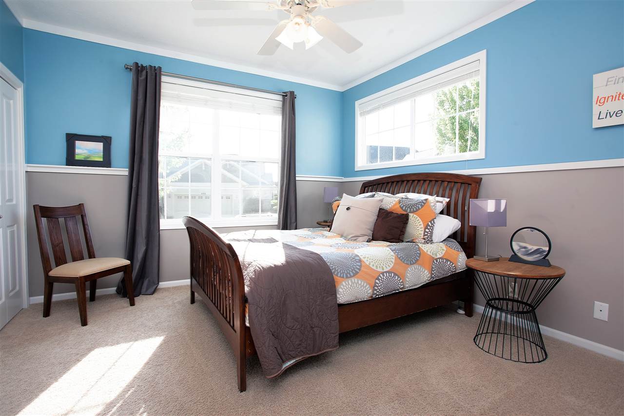 4403 Perry Ridge Lane Loves Park, IL 61111 - Photo 18 of 25 a bedroom with a bed chair and window