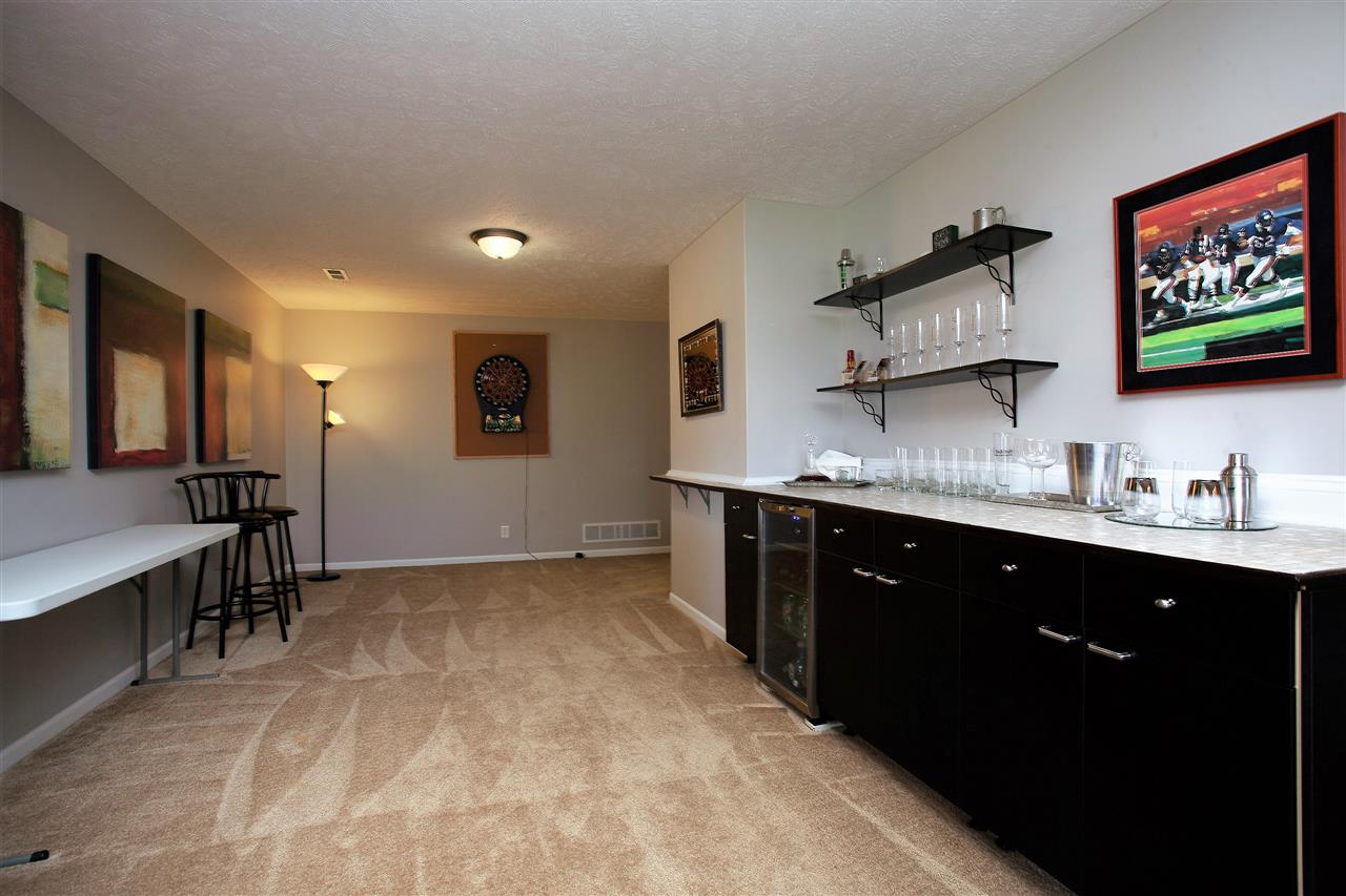 4403 Perry Ridge Lane Loves Park, IL 61111 - Photo 21 of 25 a spacious bathroom with a granite countertop sink a mirror and a