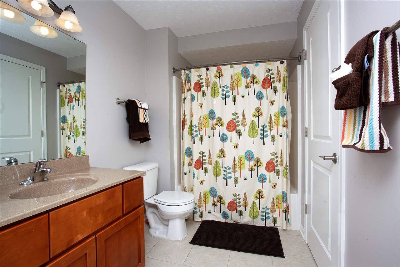 4403 Perry Ridge Lane Loves Park, IL 61111 - Photo 23 of 25 a bathroom with a sink toilet and shower