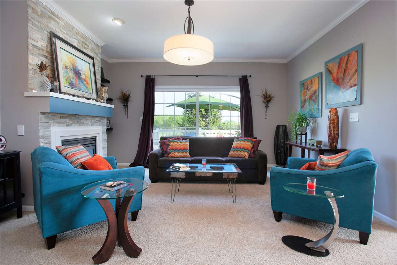 4403 Perry Ridge Lane Loves Park, IL 61111 - Photo 5 of 25 a living room with furniture and a fireplace