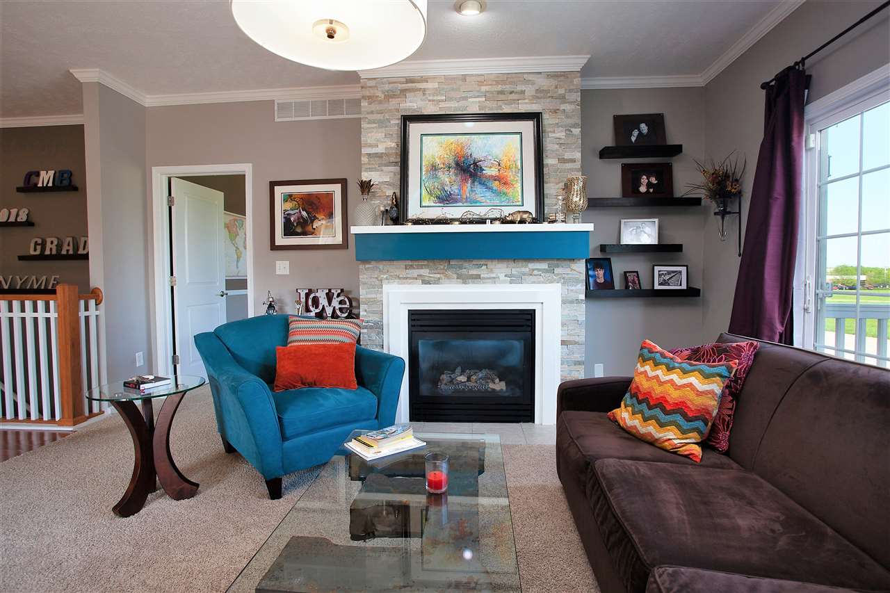 4403 Perry Ridge Lane Loves Park, IL 61111 - Photo 6 of 25 a living room with furniture and a fireplace
