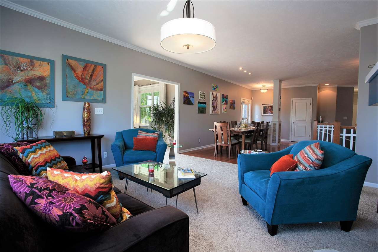 4403 Perry Ridge Lane Loves Park, IL 61111 - Photo 7 of 25 a living room with furniture and a chandelier