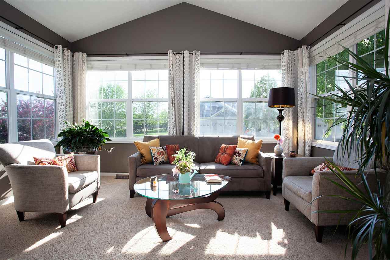4403 Perry Ridge Lane Loves Park, IL 61111 - Photo 8 of 25 a living room with furniture and a large window