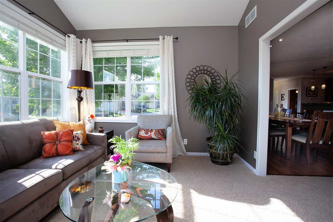 4403 Perry Ridge Lane Loves Park, IL 61111 - Photo 10 of 25 a living room filled with furniture and a large window