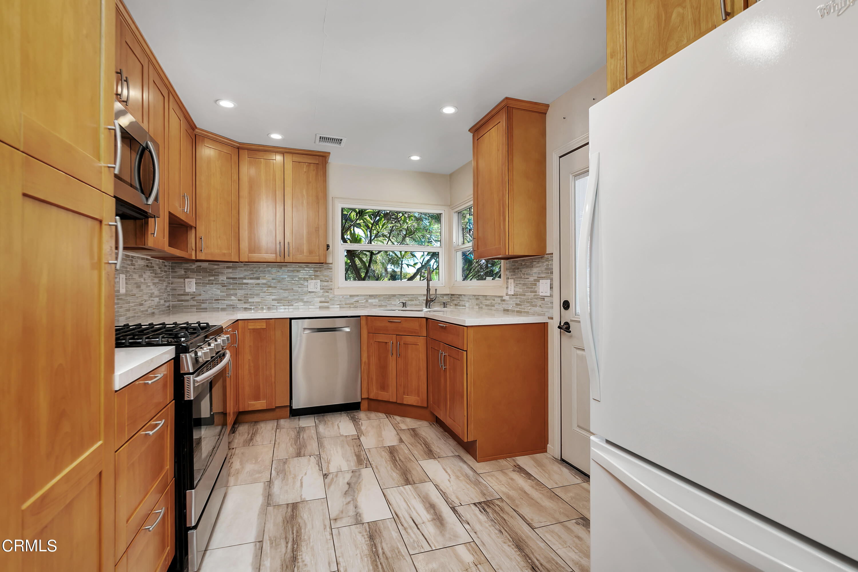 3755 Mayfair Drive Pasadena, CA 91107 - Photo 12 of 37 a kitchen with granite countertop white cabinets and white appliances