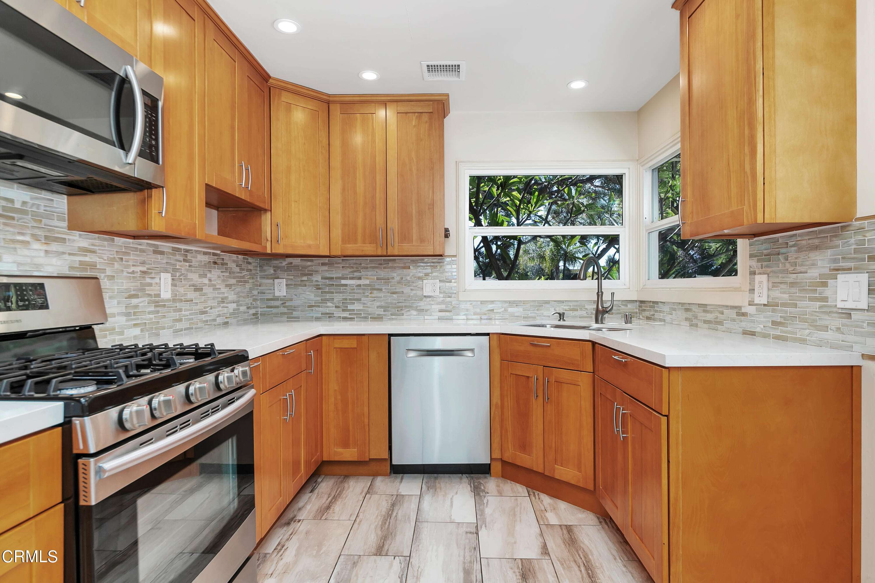 3755 Mayfair Drive Pasadena, CA 91107 - Photo 13 of 37 a kitchen with stainless steel appliances granite countertop a sink stove and cabinets