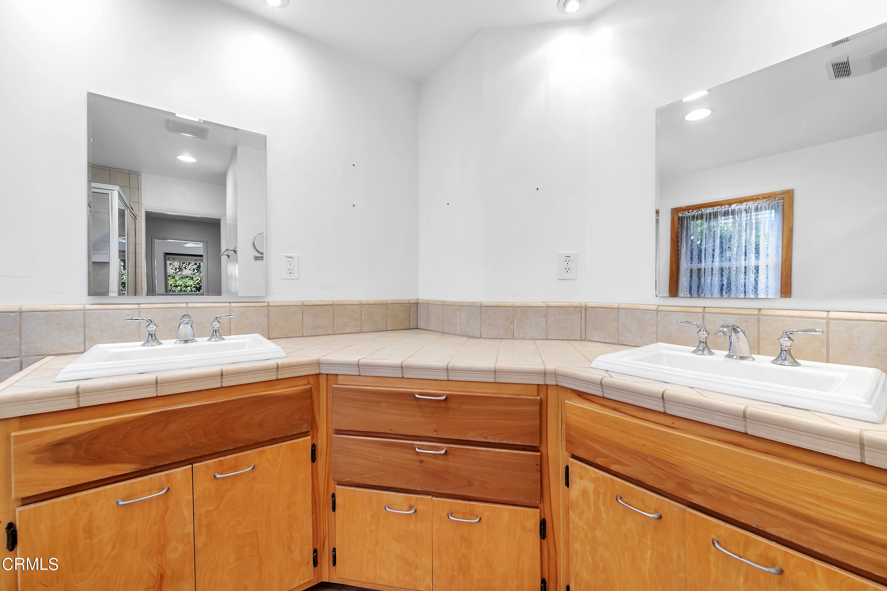 3755 Mayfair Drive Pasadena, CA 91107 - Photo 24 of 37 a bathroom with a sink and a mirror