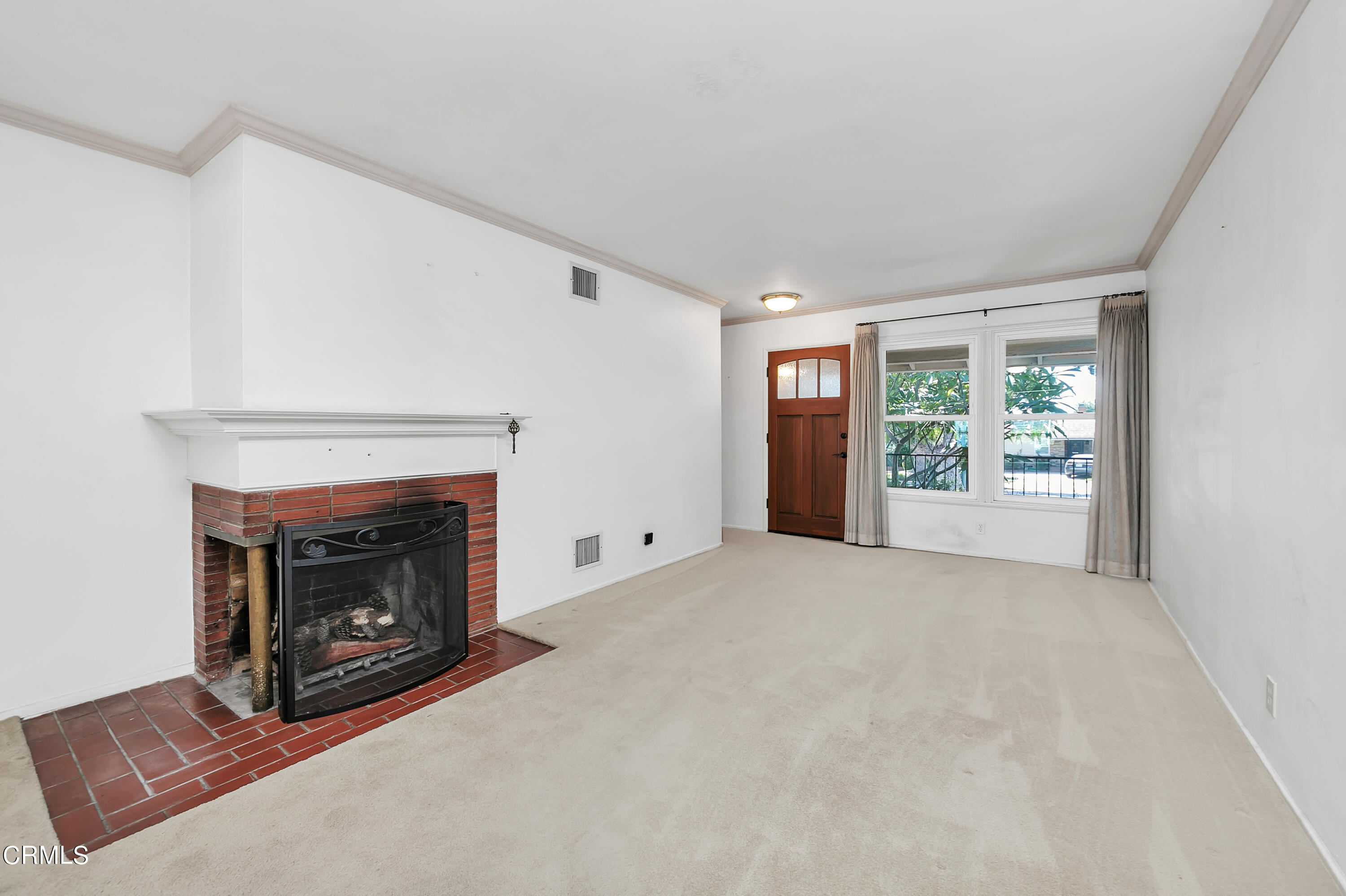 3755 Mayfair Drive Pasadena, CA 91107 - Photo 5 of 37 a view of an empty room with window and fire place