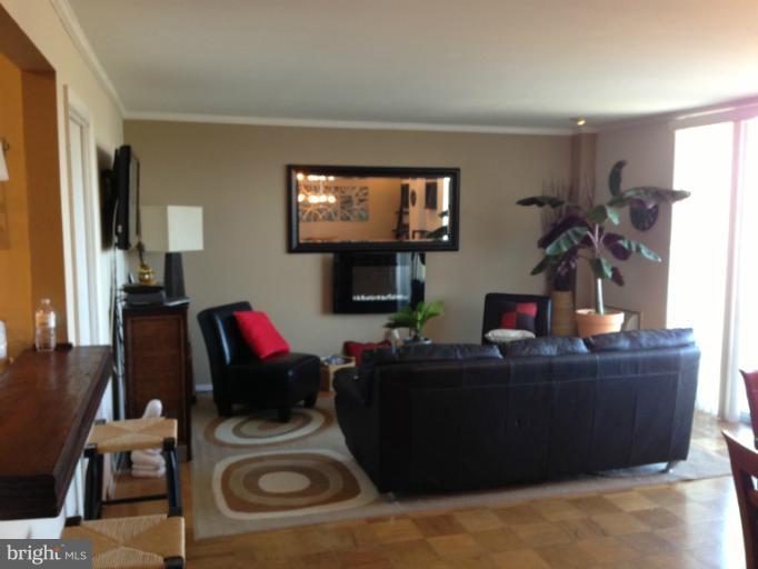 3245 Rio Drive, Unit 806 Falls Church, VA 22041 - Photo 4 of 5 a living room with furniture and a flat screen tv