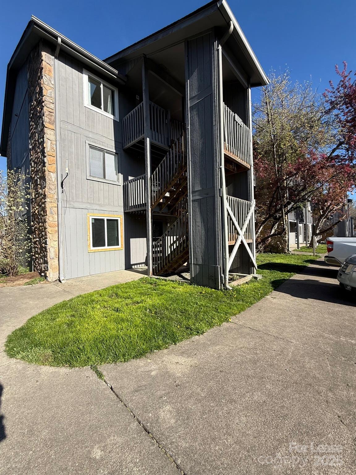 128 Zeb Street, Unit C101 Boone, NC 28607 - Photo 1 of 17 front view of a house with a yard