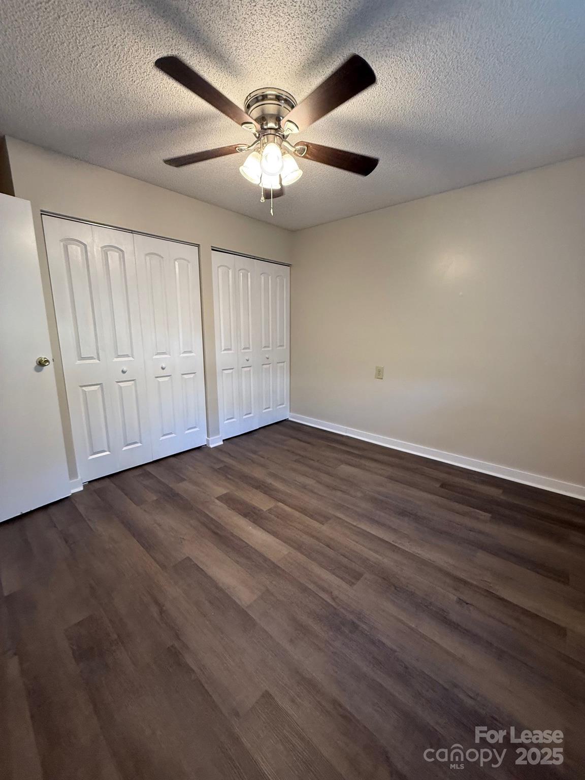 128 Zeb Street, Unit C101 Boone, NC 28607 - Photo 12 of 17 an empty room with wooden floor and windows