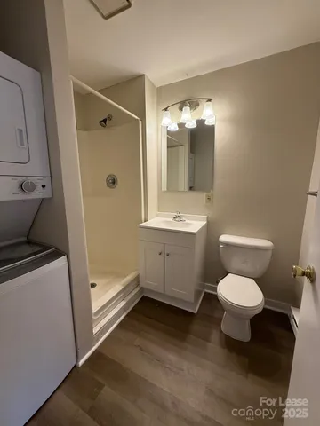 a bathroom with a toilet sink and a mirror