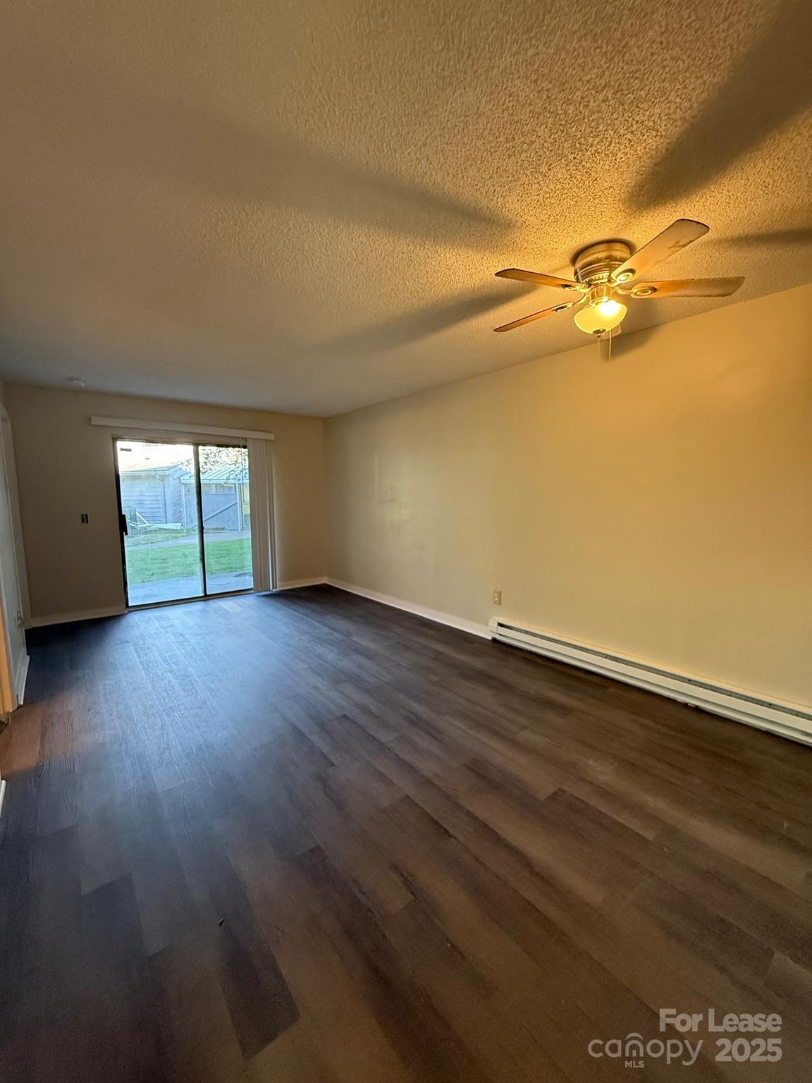 128 Zeb Street, Unit C101 Boone, NC 28607 - Photo 15 of 17 a view of a room with wooden floor and fan