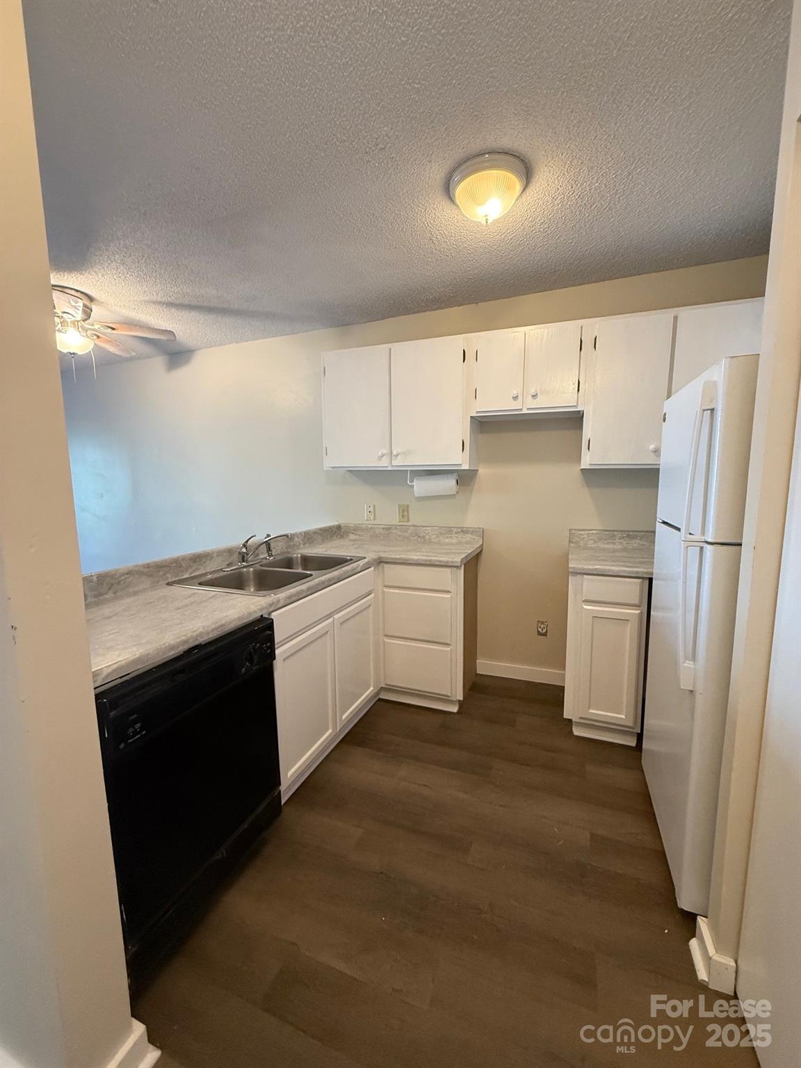 128 Zeb Street, Unit C101 Boone, NC 28607 - Photo 3 of 17 a kitchen with a sink stove and refrigerator