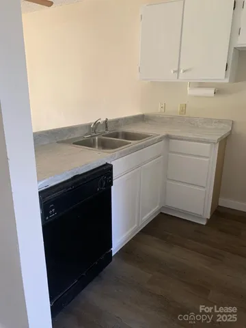 a kitchen with a sink and a stove