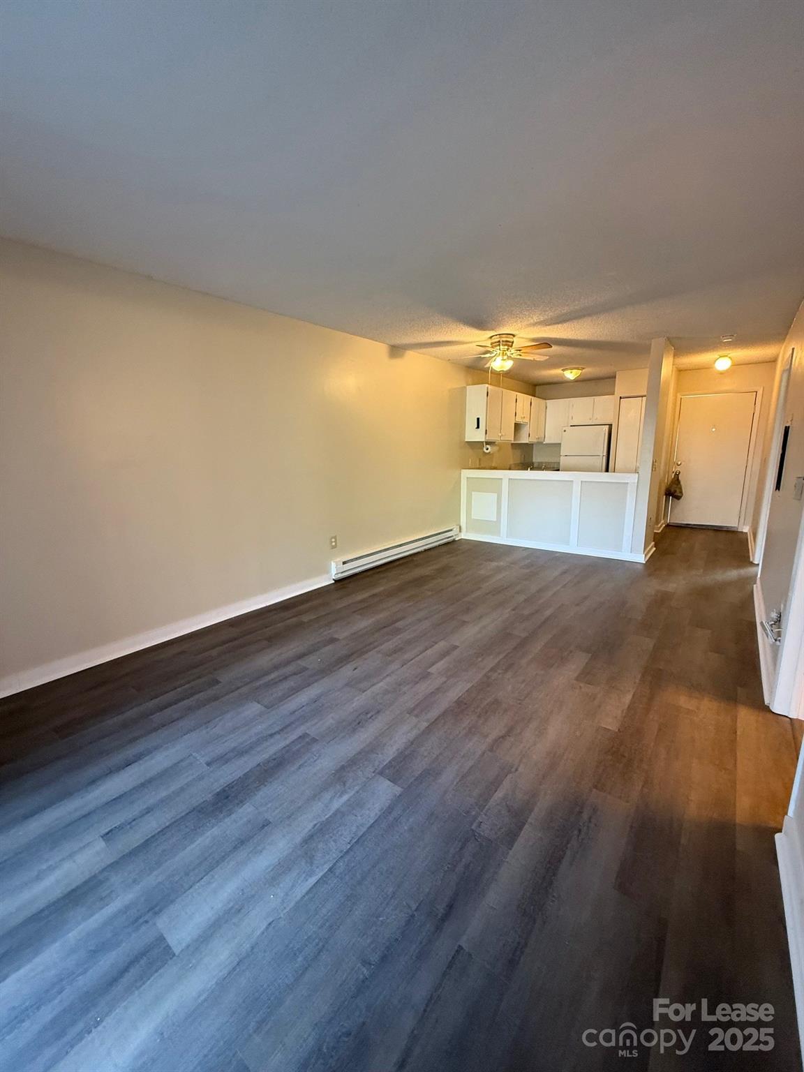 128 Zeb Street, Unit C101 Boone, NC 28607 - Photo 7 of 17 a view of a big room with wooden floor and windows